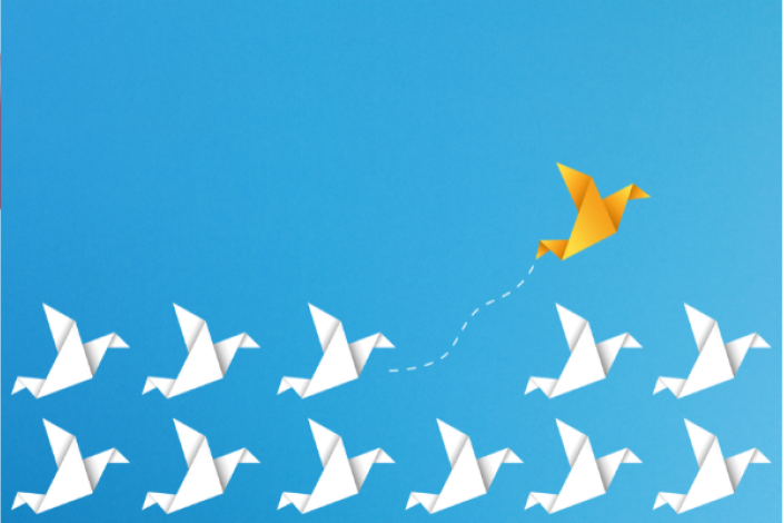 group of white origami birds on a blue background. one yellow origami bird is going upward, separated from the others.